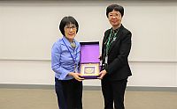 Prof. Fanny CHEUNG (left), Pro-Vice-Chancellor of CUHK, presents a souvenir to Ms Zhan Shige, Deputy Director of Hong Kong, Macau and Taiwan Office of NSFC
